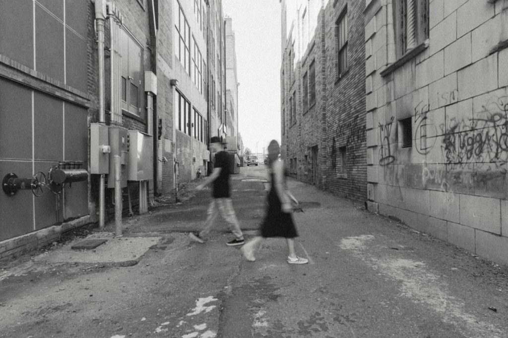 blurry walking black & white photo