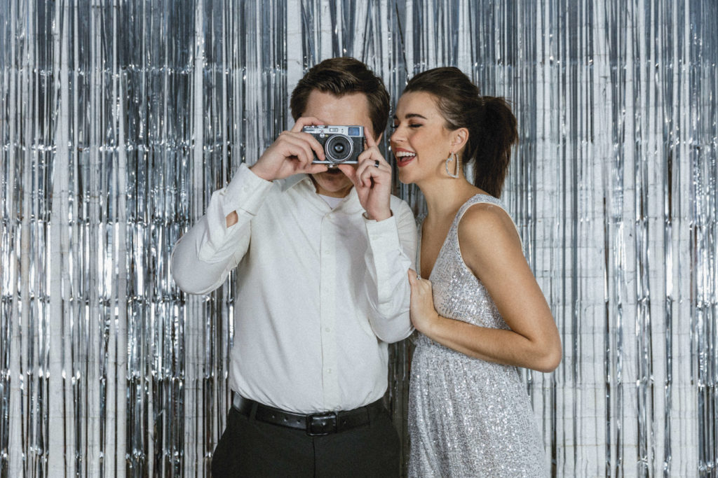 couple taking a photo and laughing
