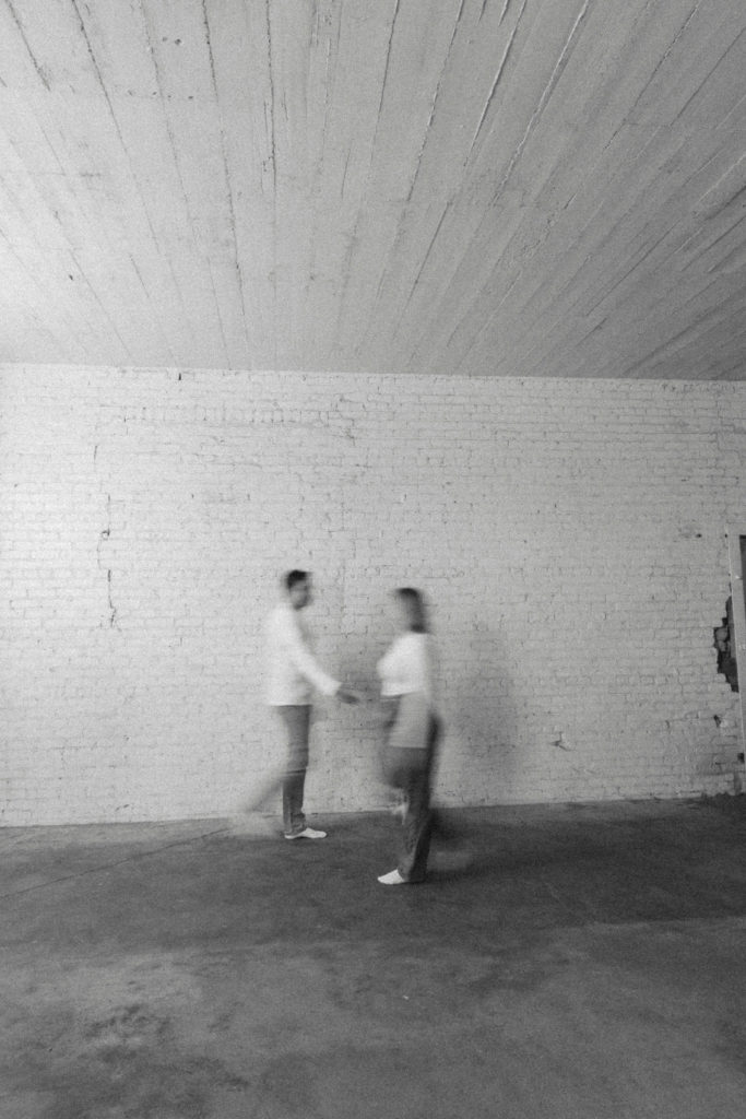 blurry black and white walking photo