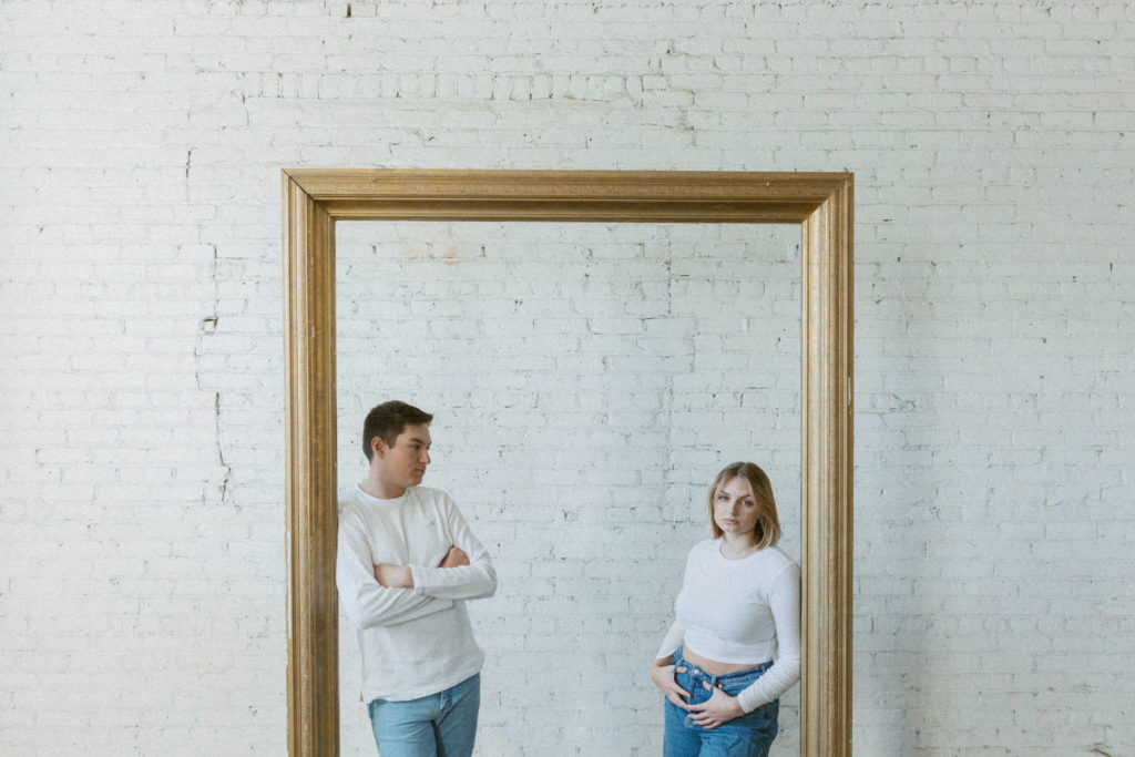 couple standing inside frame 