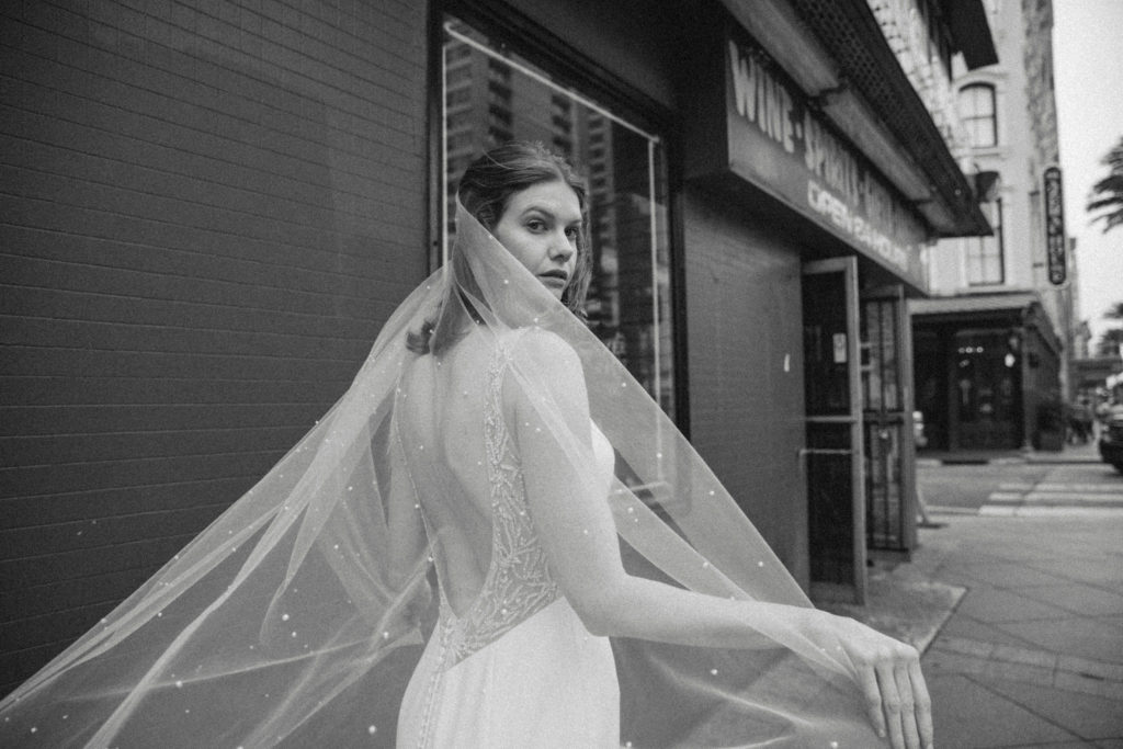 black and white photo of bride on bourbon street 