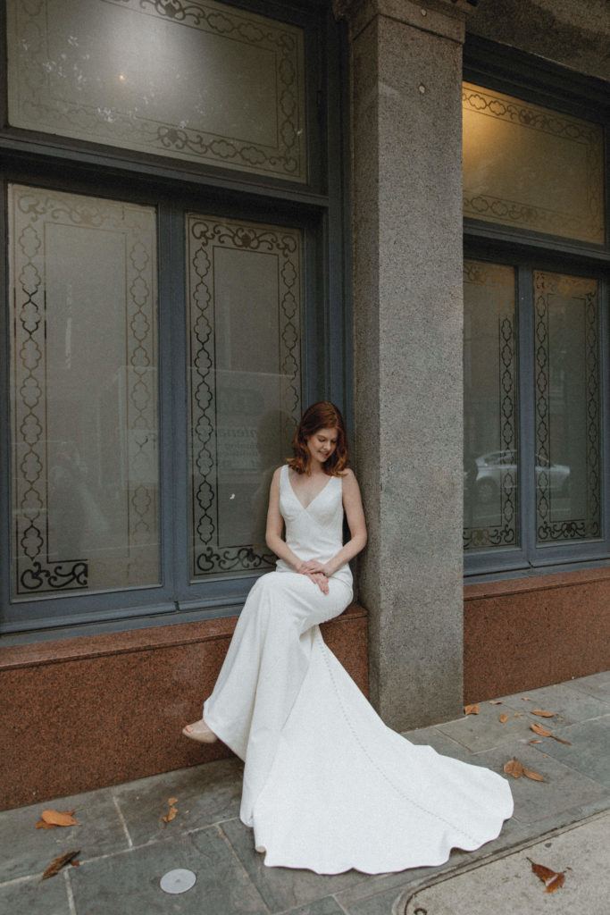 bride sitting in window 