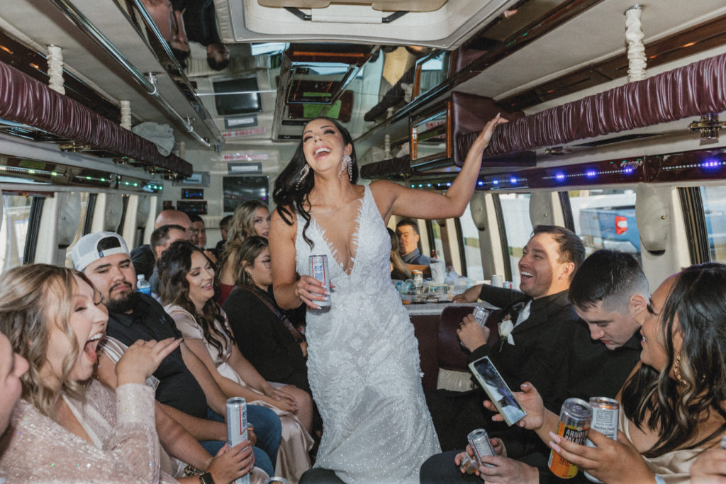 bride laughing on party bus 