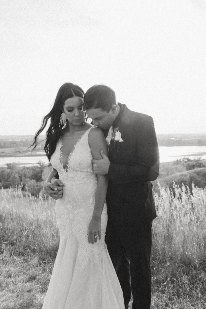intimate black and white photo of bride and groom 