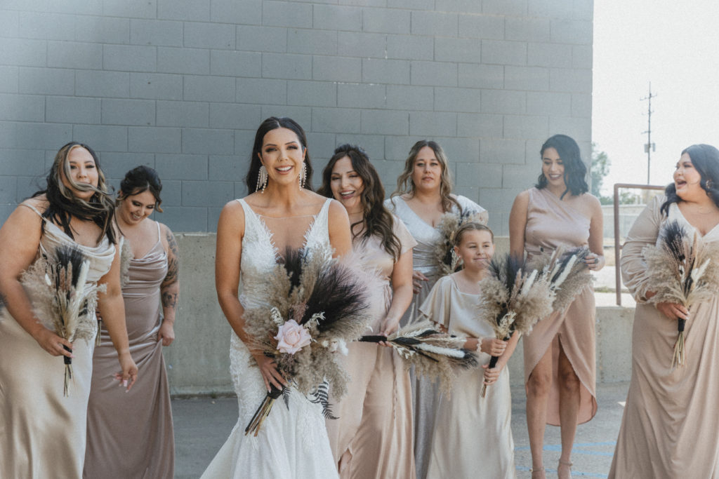 bride and her bridal party walking 