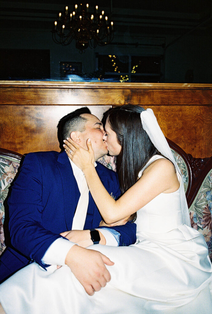 35mm film photo of bride and groom kissing
